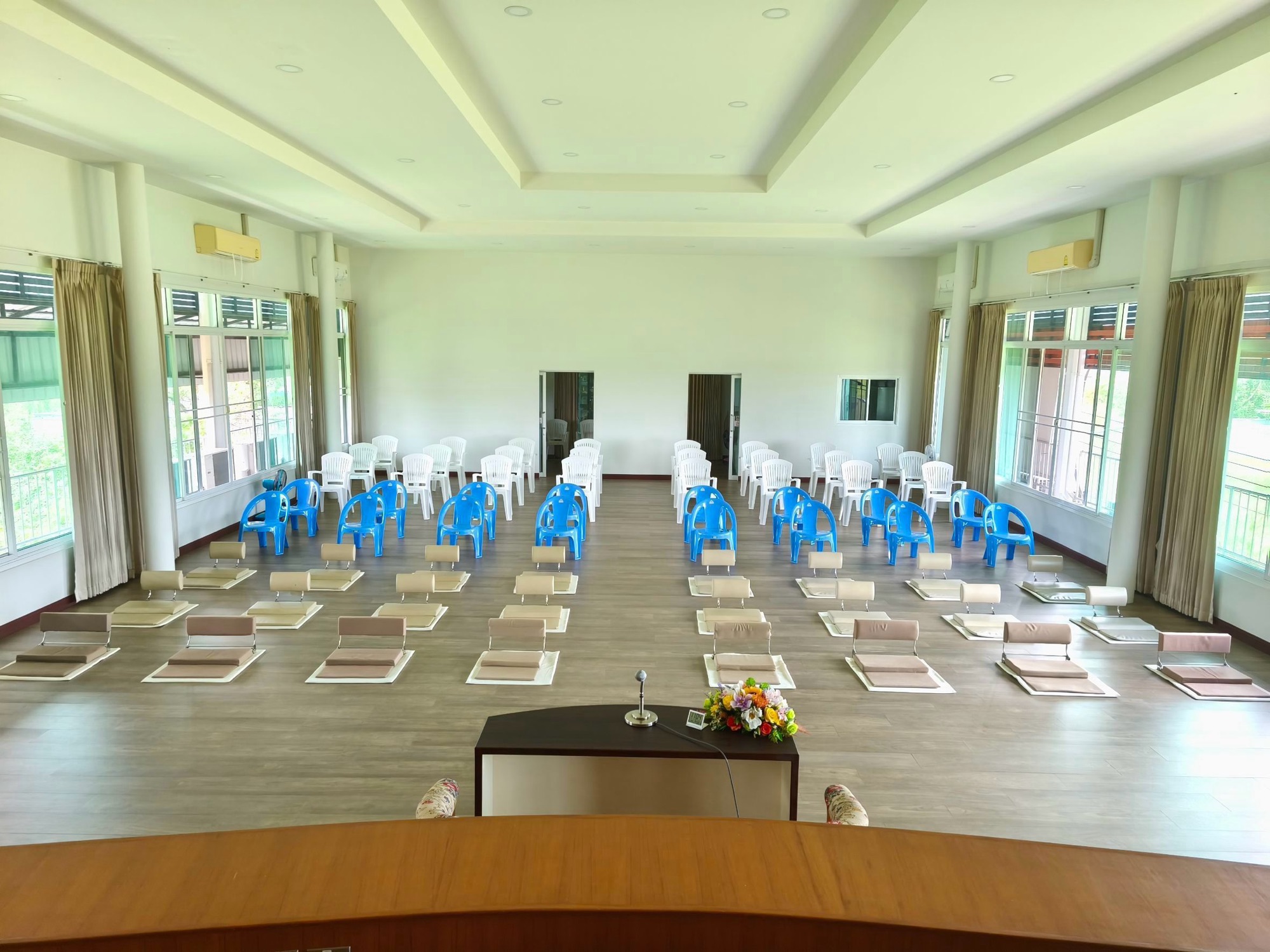 The meditation hall, set with floor cushions and chairs